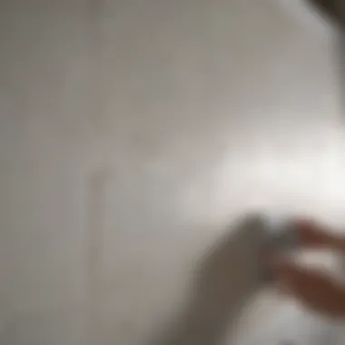 Repairing Bathroom Wall Leaks Close-up of a bathroom wall being repaired to fix a leak.