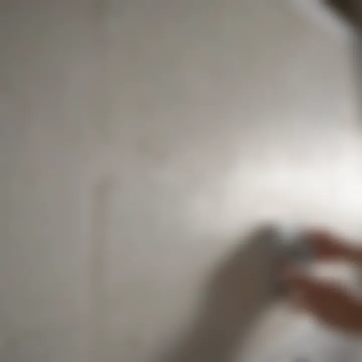 Repairing Bathroom Wall Leaks Close-up of a bathroom wall being repaired to fix a leak.