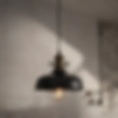 Industrial Pendant Fixture Black industrial pendant light hanging in a contemporary bathroom setting