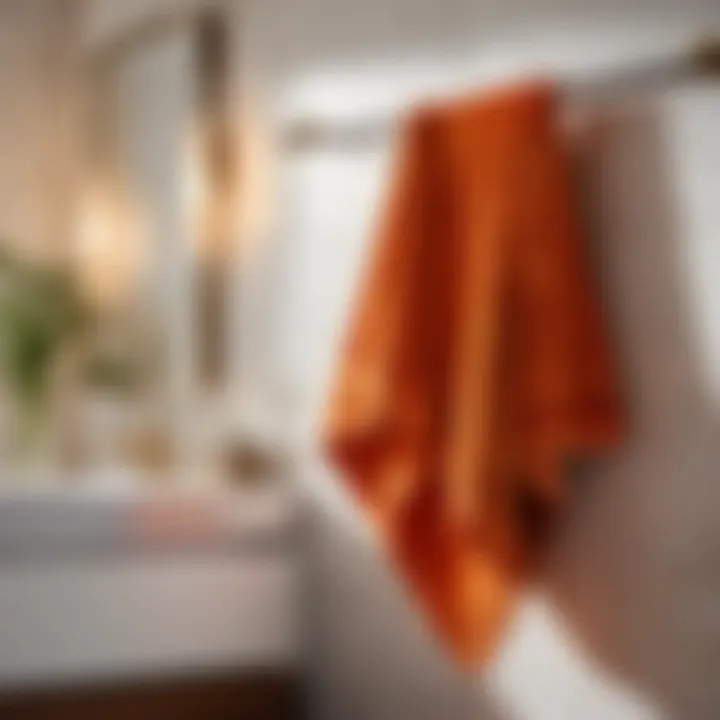 Bright orange bath towel folded elegantly on a bathroom counter