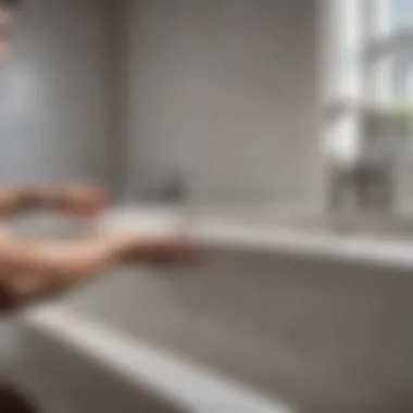 Professional Finish on Bathtub Professional painter applying finish to a bathtub