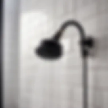 Matte Showerhead Against White Tiles Black matte showerhead against white tiles in contemporary bathroom