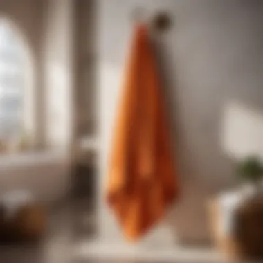 Luxurious Orange Bath Towel Luxurious orange bath towel on a sleek bathroom rack