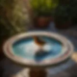 Tile bird bath with intricate mosaic design
