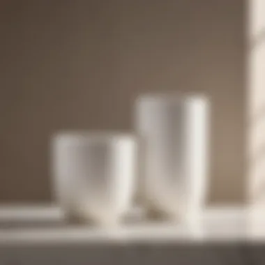 Harmonious Blend in Minimalist Bathroom Setting White ceramic bathroom tumbler against a backdrop of minimalist bathroom decor