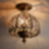 Antique bronze bathroom light fixture with intricate floral design