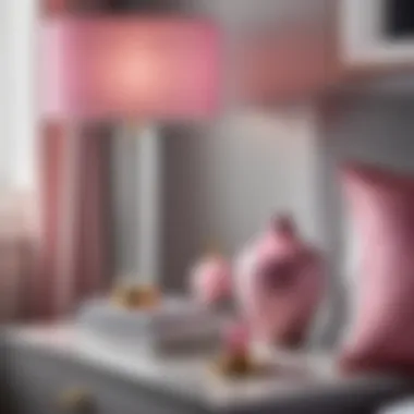 Elegant pink and gray decor accessories on chic nightstand
