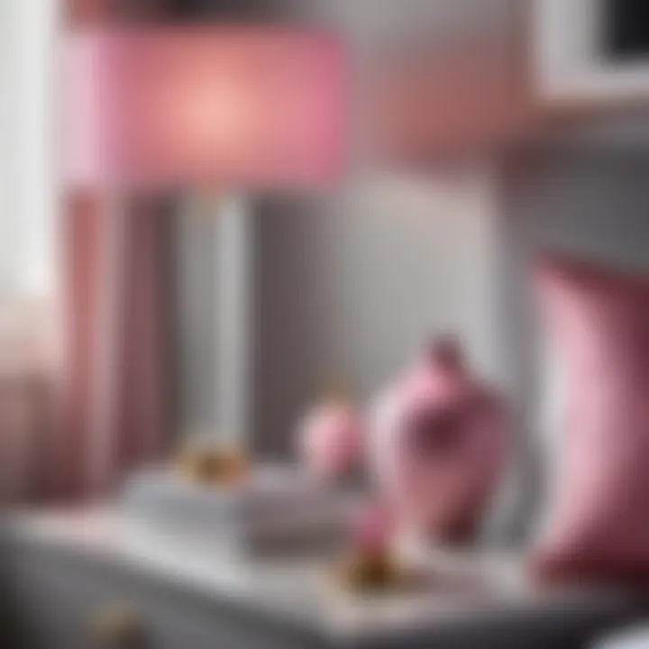 Elegant pink and gray decor accessories on chic nightstand