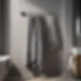 Elegant Drape of Grey Striped Bath Towels Elegant grey striped bath towels elegantly draped on a towel rack