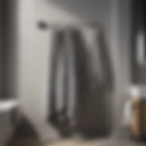Elegant Drape of Grey Striped Bath Towels Elegant grey striped bath towels elegantly draped on a towel rack