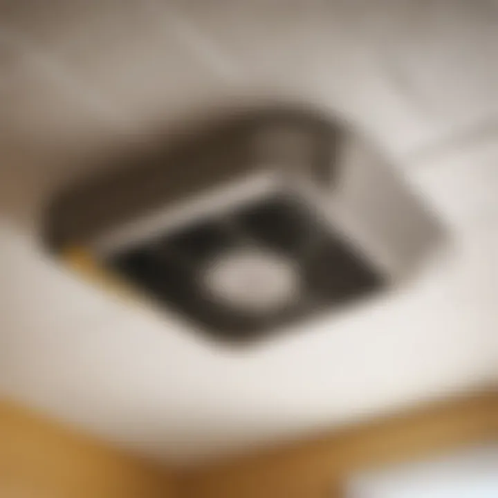 A bathroom exhaust fan with a clogged vent