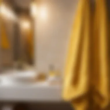 Golden yellow bath towels elegantly draped over a modern bathroom rack