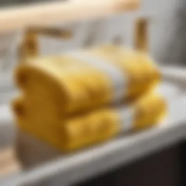 Golden yellow bath towel neatly folded on a marble countertop