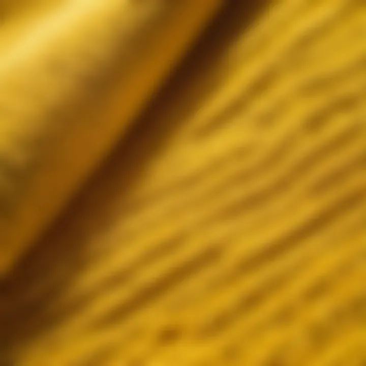 Close-up of the intricate golden yellow weaving pattern on a bath towel