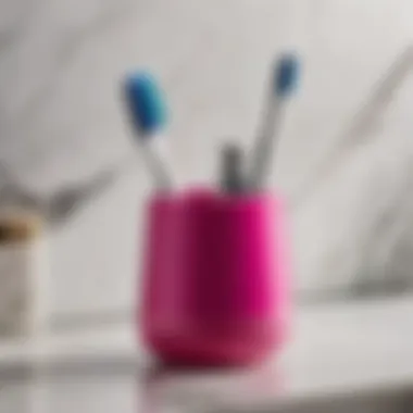 Chic hot pink toothbrush holder on marble countertop