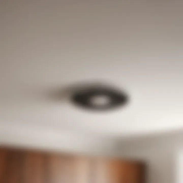 Installation process of flush mount bathroom fan in progress