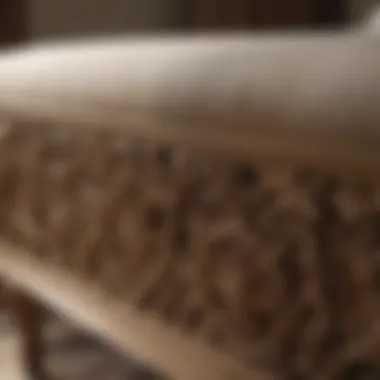 Close-up of intricate detailing on a tan bench in a sophisticated bedroom