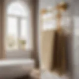 Elegant gold towel rack set hanging in a luxury bathroom
