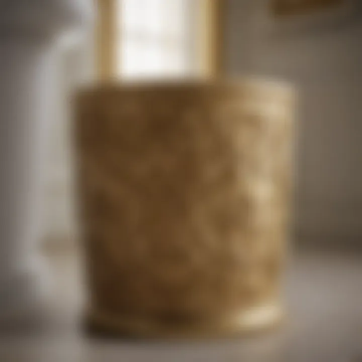 Luxurious gold-toned bathroom wastebasket with intricate design