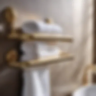 Close-up of gold towel rack with neatly arranged towels