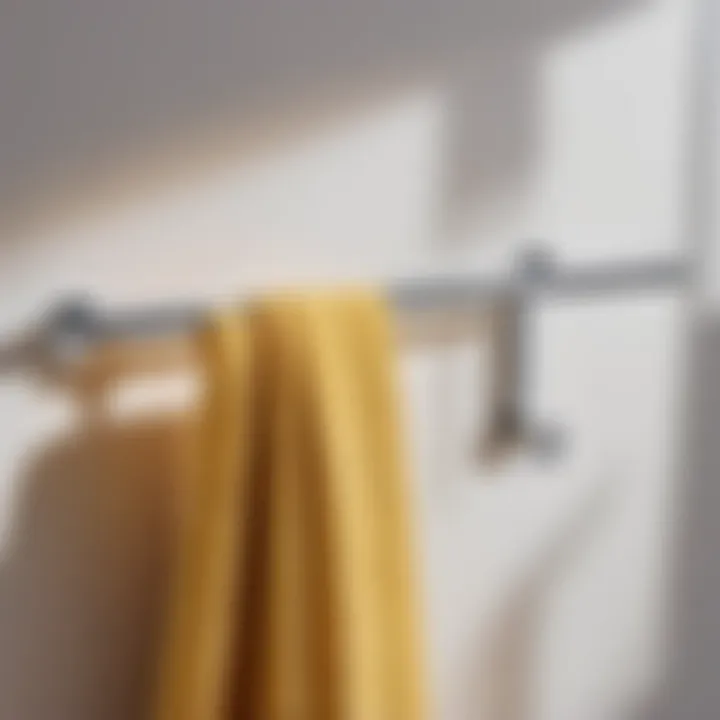 Sleek Towel Hooks Sleek towel hooks on minimalist bathroom wall
