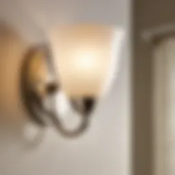 Modern brushed nickel wall sconce in a bathroom setting