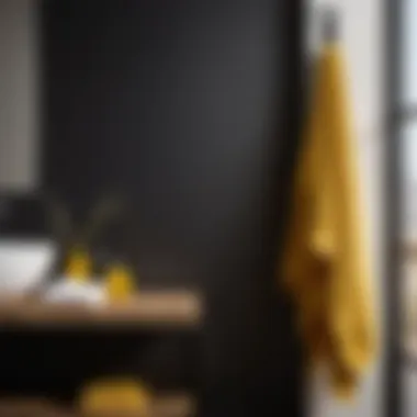 Minimalistic black and yellow bath towels on towel rack