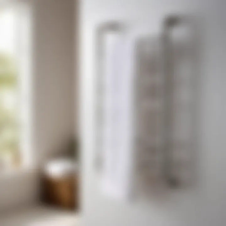 Minimalist white towel rack with folded towels