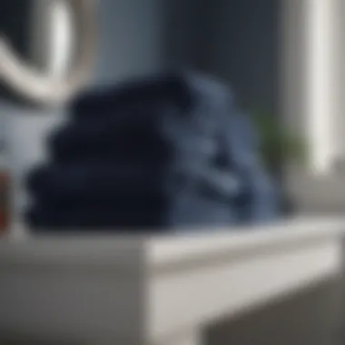 Sophisticated Display of Navy Blue Bath Towels Elegant navy blue bath towels folded in a stylish display