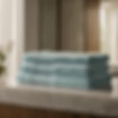 Symmetry in Supima Cotton Bath Sheet Presentation A pair of supima cotton bath sheets neatly folded on a pristine marble countertop