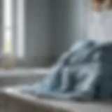 Luxurious Draping Over Marble Elegant pale blue bath towels draped over a marble countertop