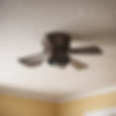 Modern bathroom exhaust fan being removed from ceiling