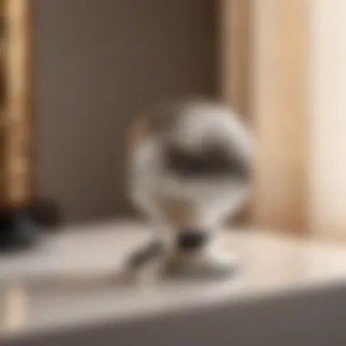 Geometric Silver Knob Sleek silver geometric knob on white bedside table