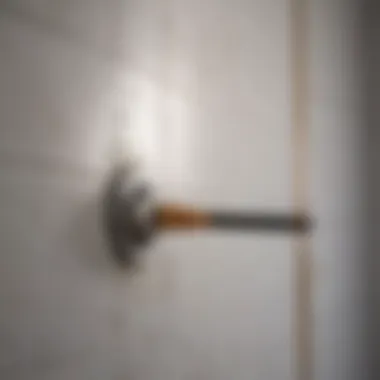 Effective Grime Removal Close-up of a scrubbing tool removing grime from bathroom tile walls