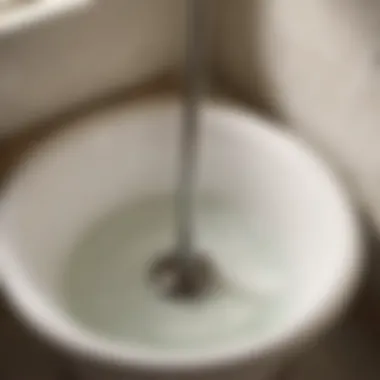 Plunger Method for Unclogging Bathtub Drain Illustration of using a plunger to unclog bathtub drain