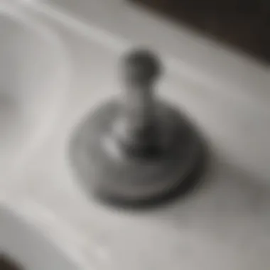 Detailed Examination of Sink Stopper Mechanisms Close-up of a sink stopper mechanism showing detailed parts